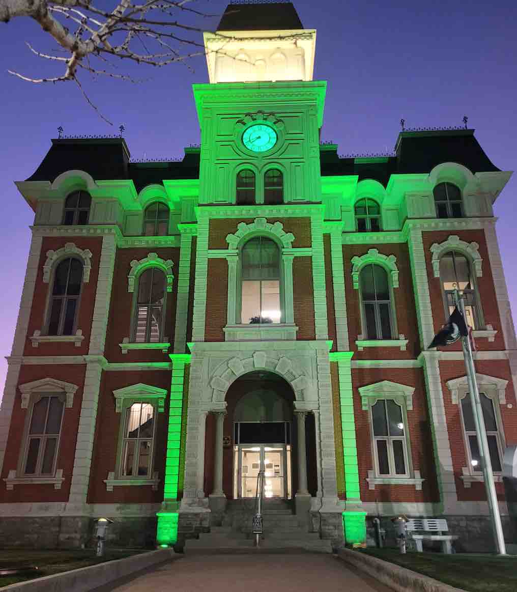 DEFIANCE COUNTY COURTHOUSE ILLUMINATED GREEN IN SUPPORT OF VETERANS